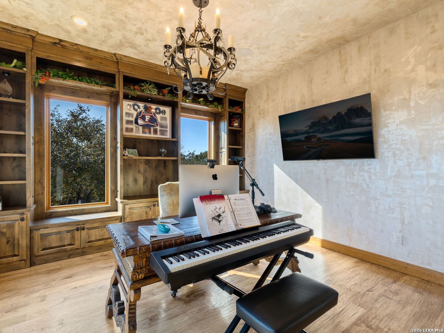 14454 Santa Rita Helotes, TX 78023 - Photo 42 of 70 a living room with furniture and a flat screen tv