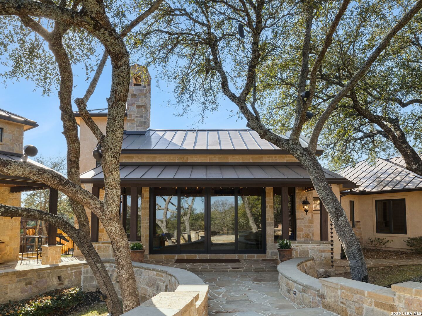14454 Santa Rita Helotes, TX 78023 - Photo 44 of 70 a front view of a house with garden