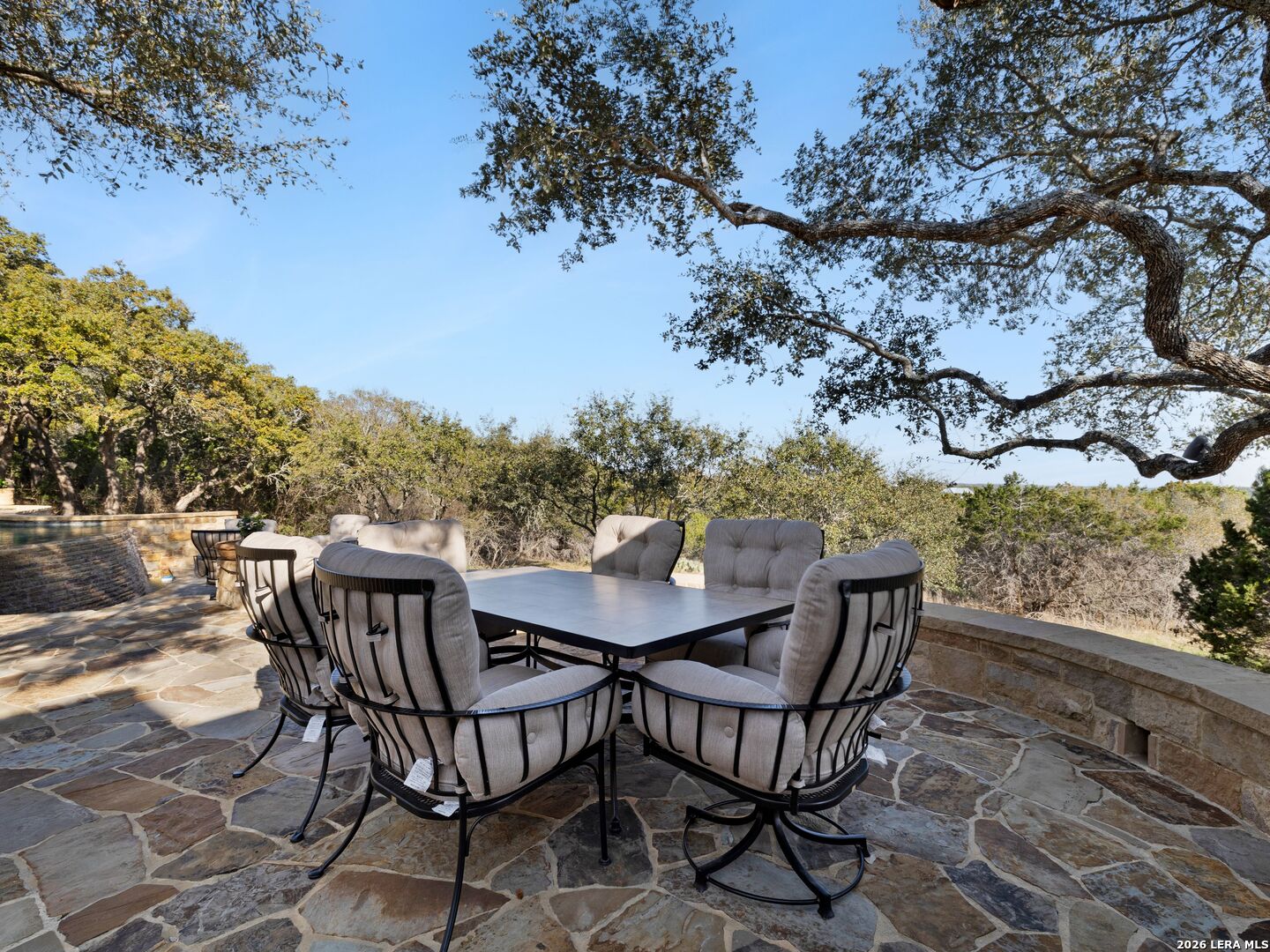 14454 Santa Rita Helotes, TX 78023 - Photo 52 of 70 a view of a chairs and table on the terrace