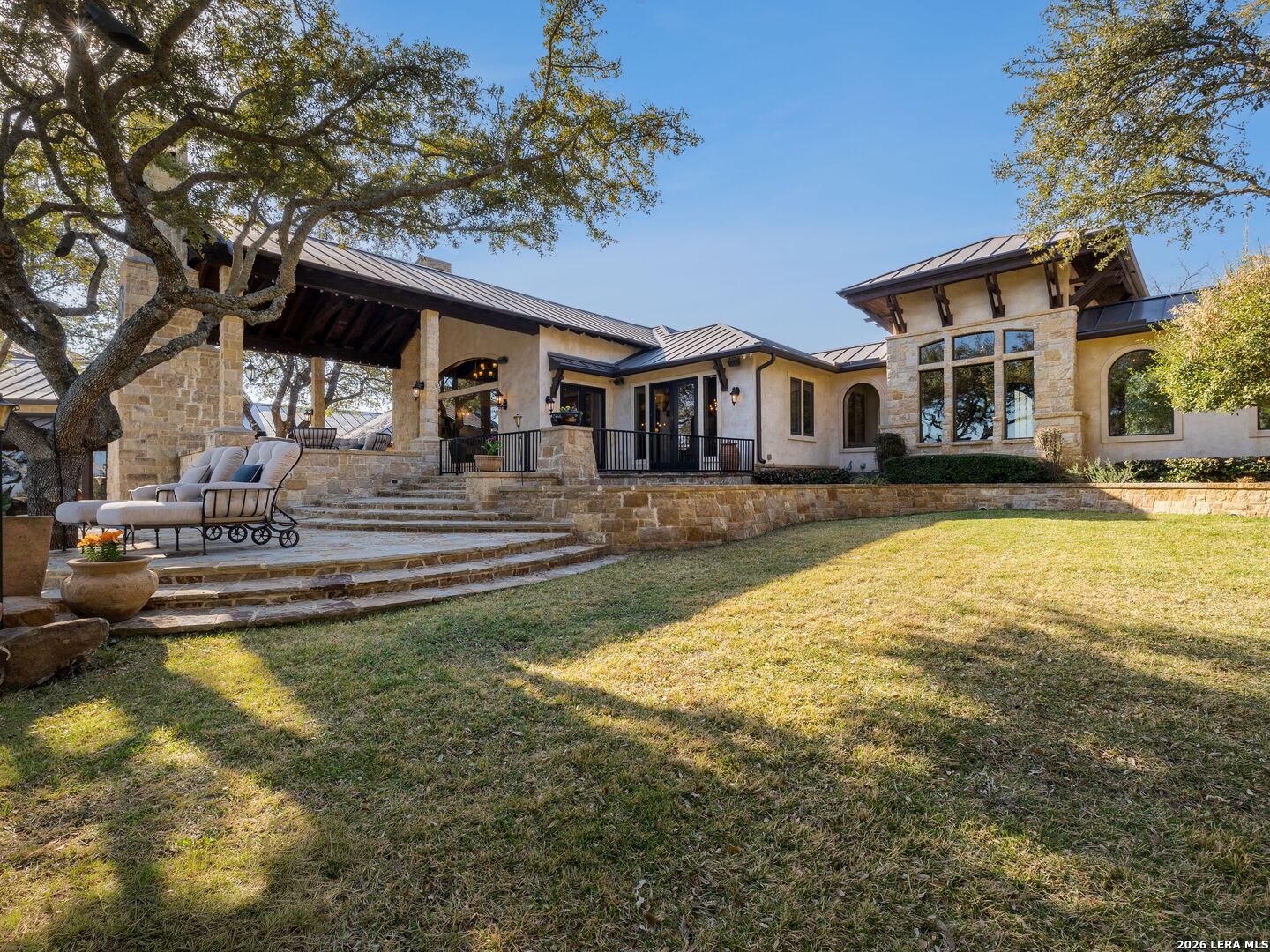 14454 Santa Rita Helotes, TX 78023 - Photo 59 of 70 a front view of a house with swimming pool and porch