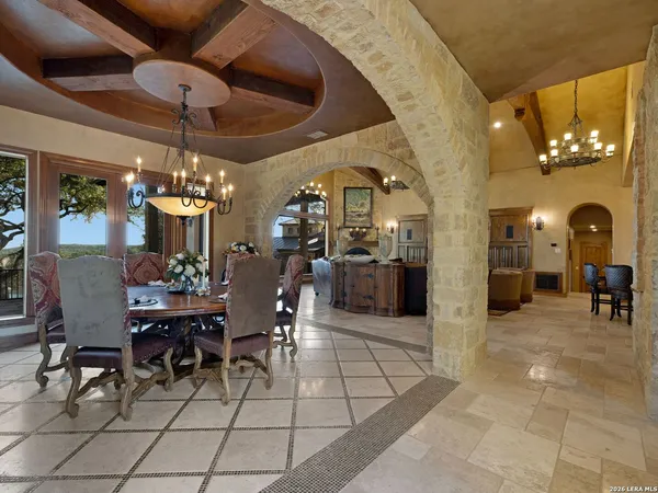 a living room with furniture ceiling fan and a rug