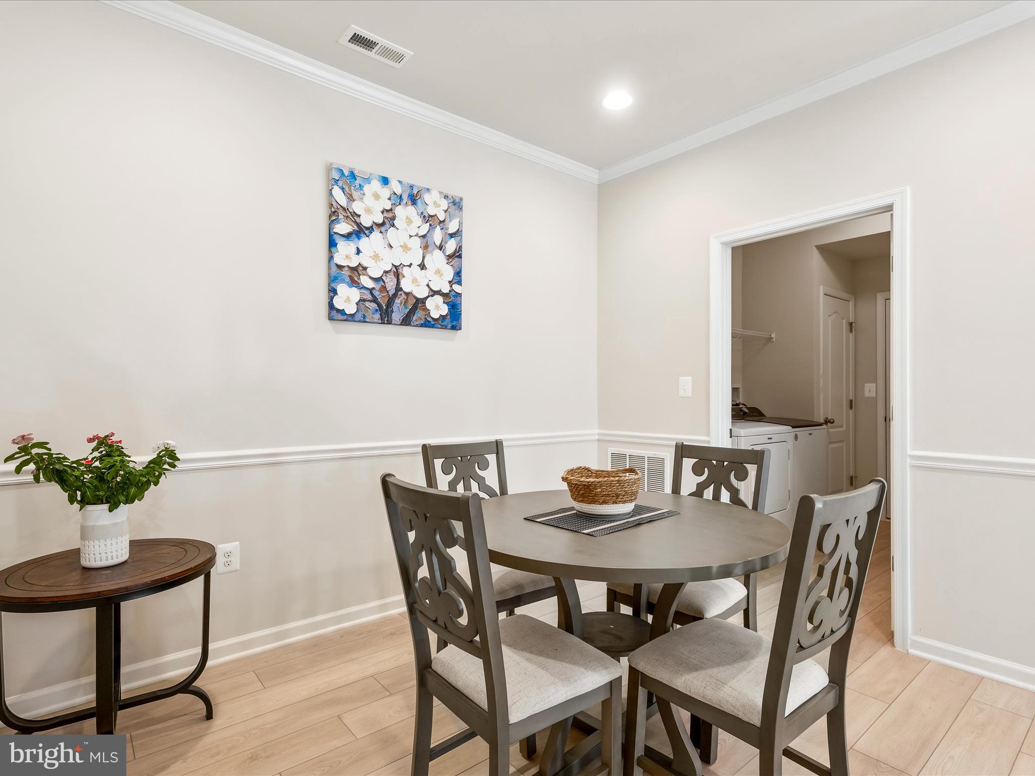13444 Petrel Street Clarksburg, MD 20871 - Photo 12 of 45 a view of a dining room with furniture and wooden floor