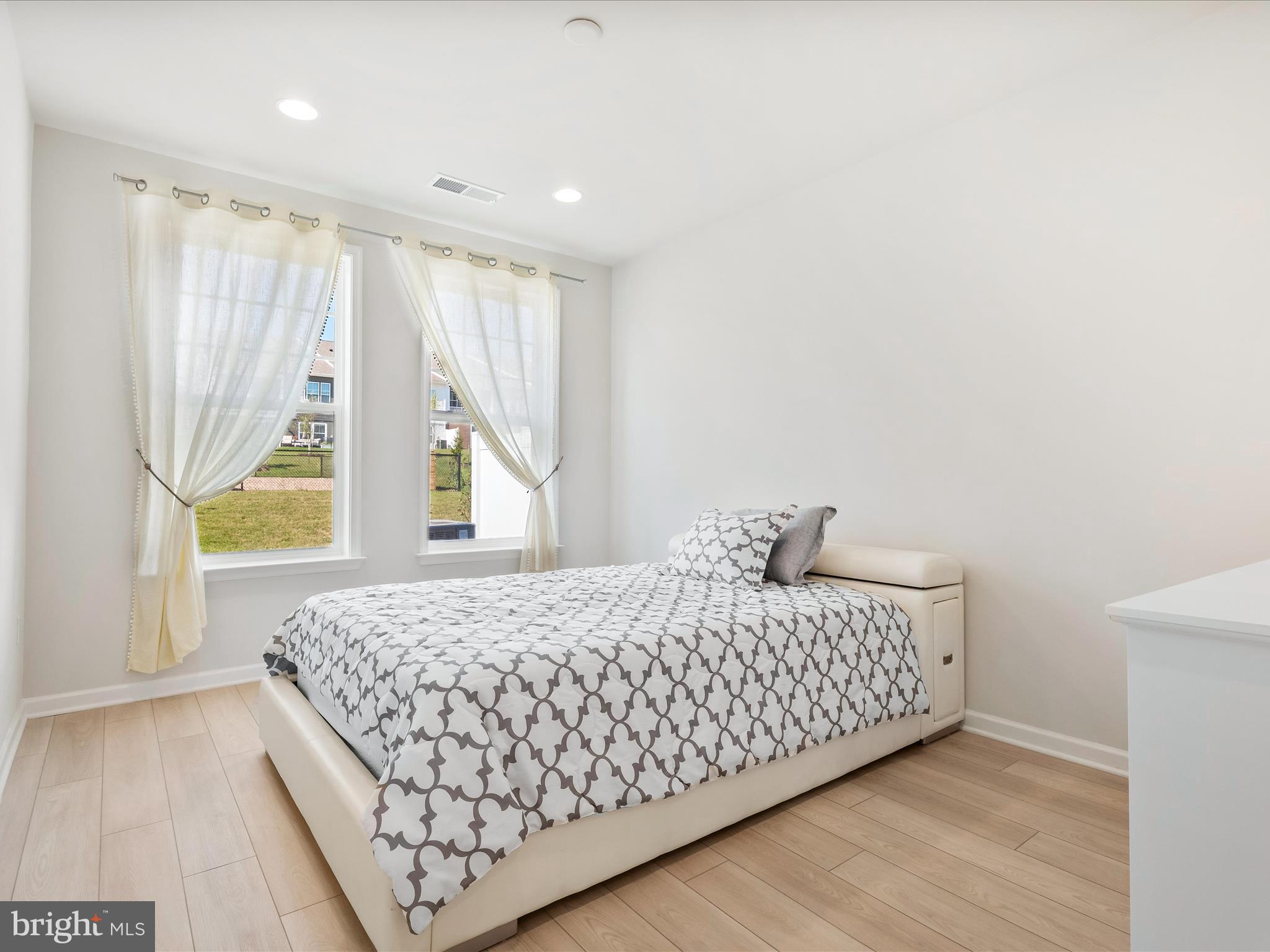 13444 Petrel Street Clarksburg, MD 20871 - Photo 14 of 45 a bedroom with a bed and a window