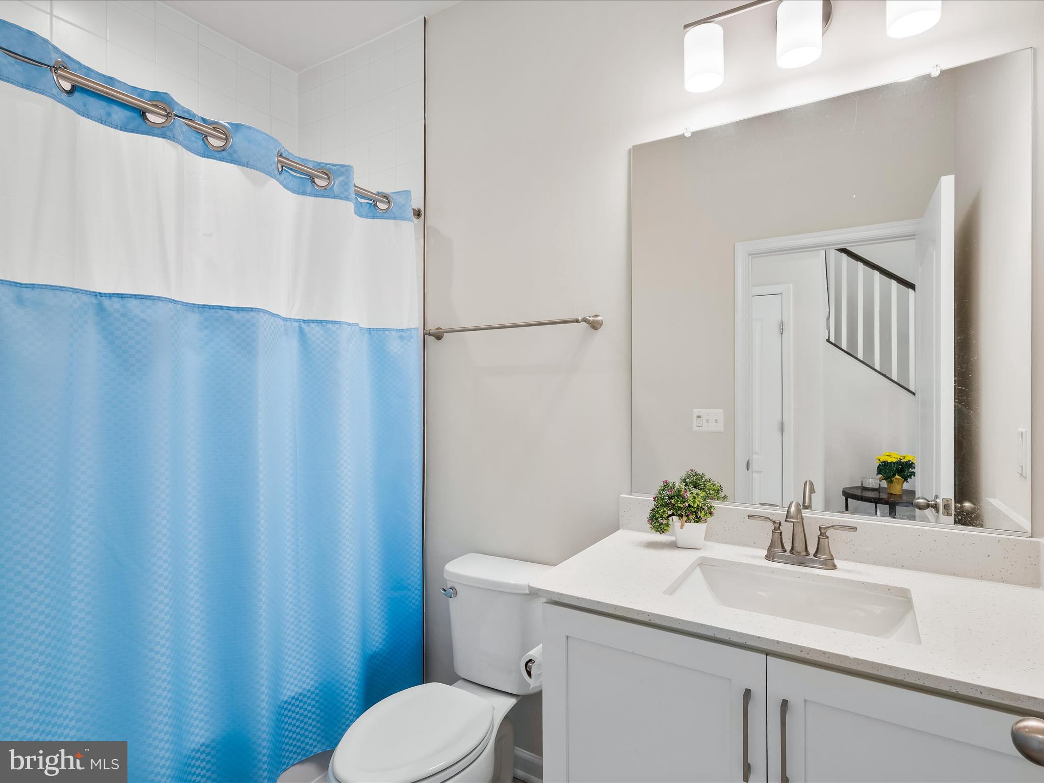 13444 Petrel Street Clarksburg, MD 20871 - Photo 19 of 45 a bathroom with a sink and a mirror