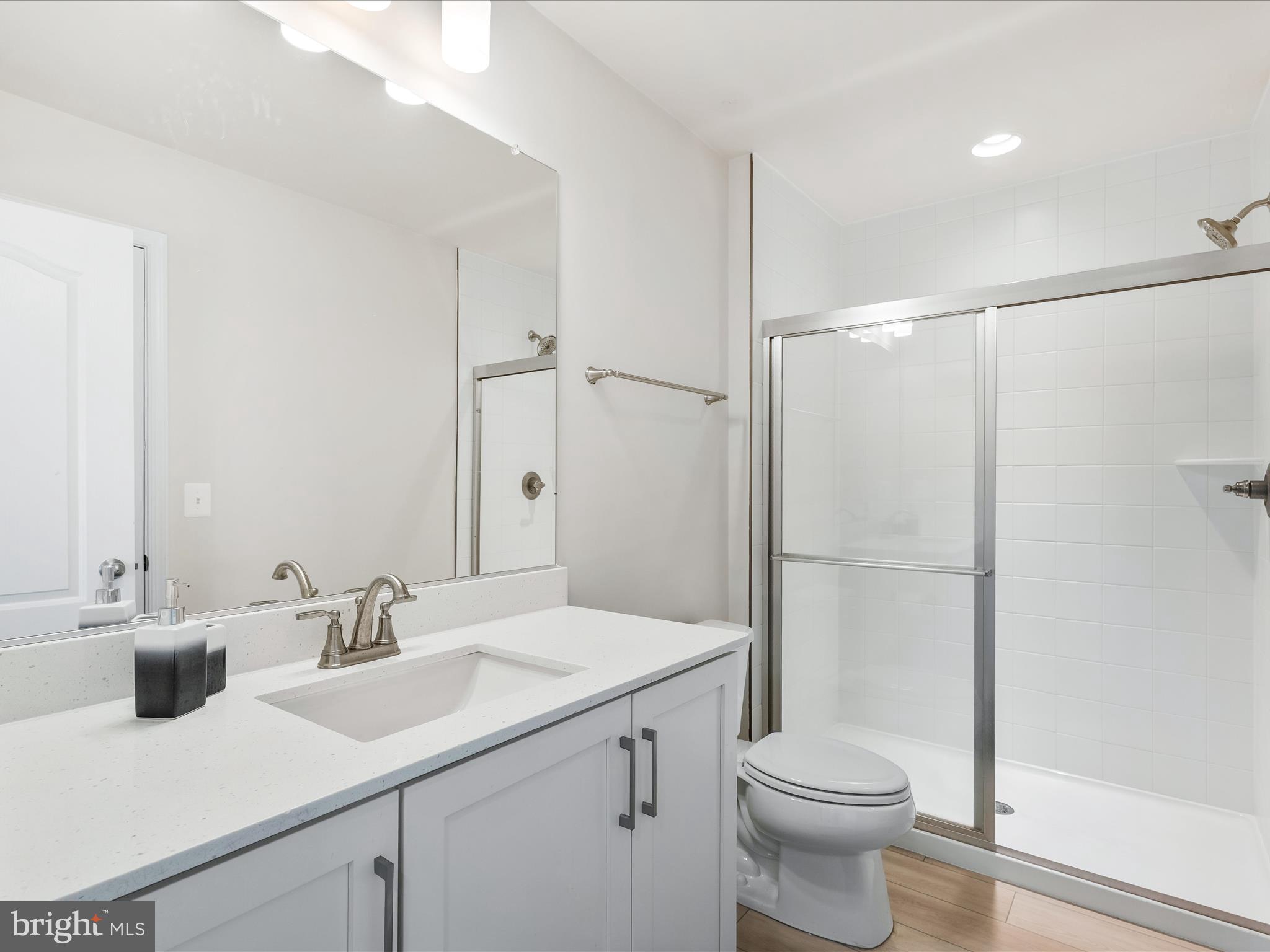 13444 Petrel Street Clarksburg, MD 20871 - Photo 27 of 45 a bathroom with a sink toilet and shower