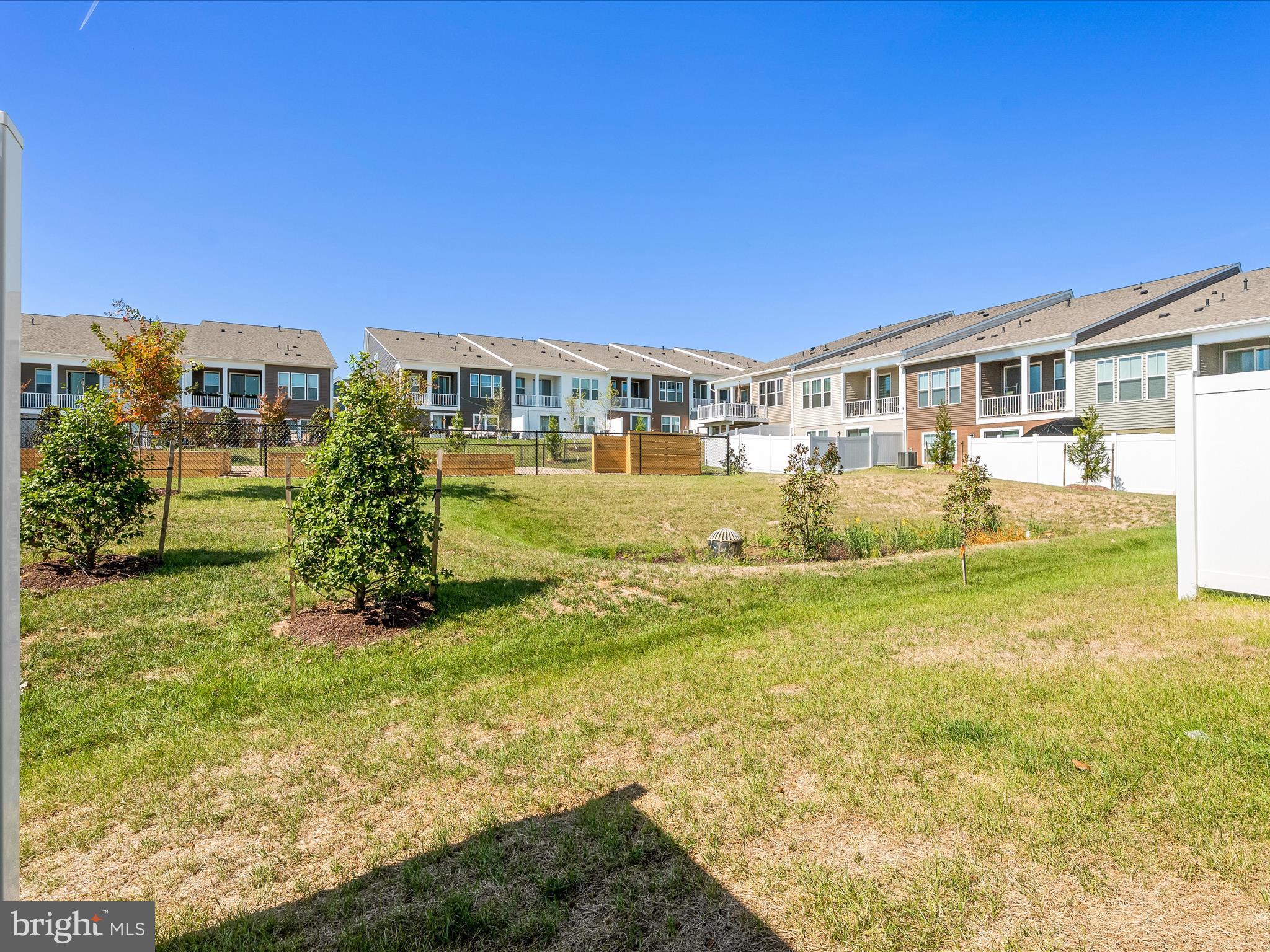 13444 Petrel Street Clarksburg, MD 20871 - Photo 30 of 45 a front view of a house with a yard