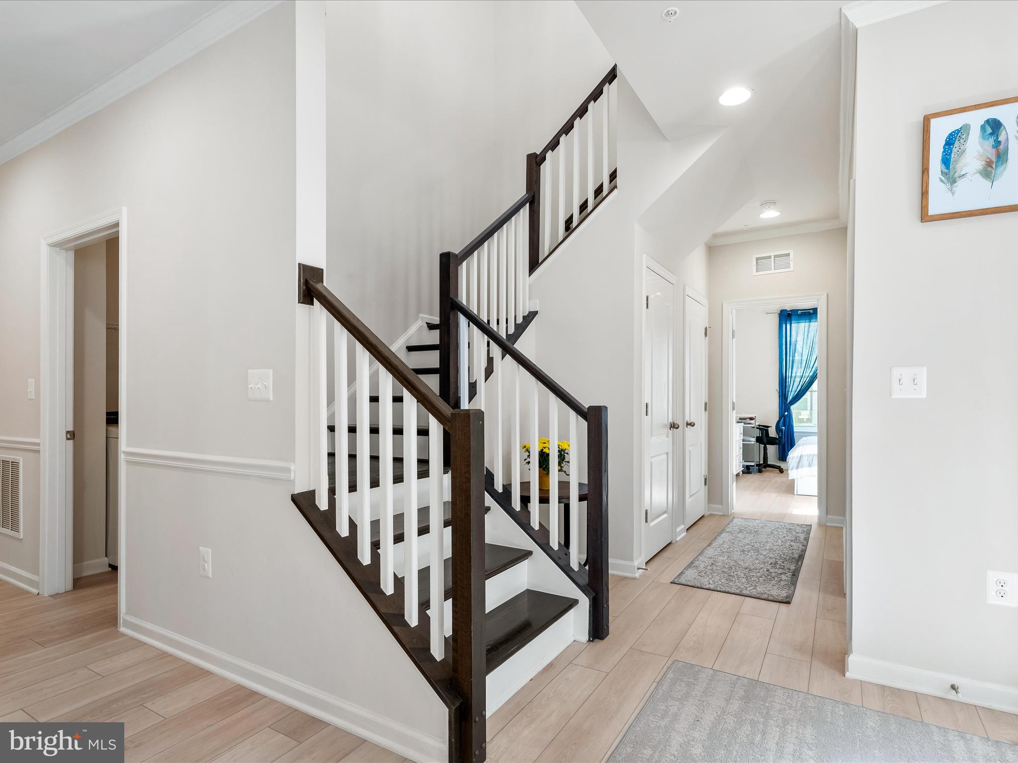 13444 Petrel Street Clarksburg, MD 20871 - Photo 4 of 45 a view of a hallway with wooden floor and entryway