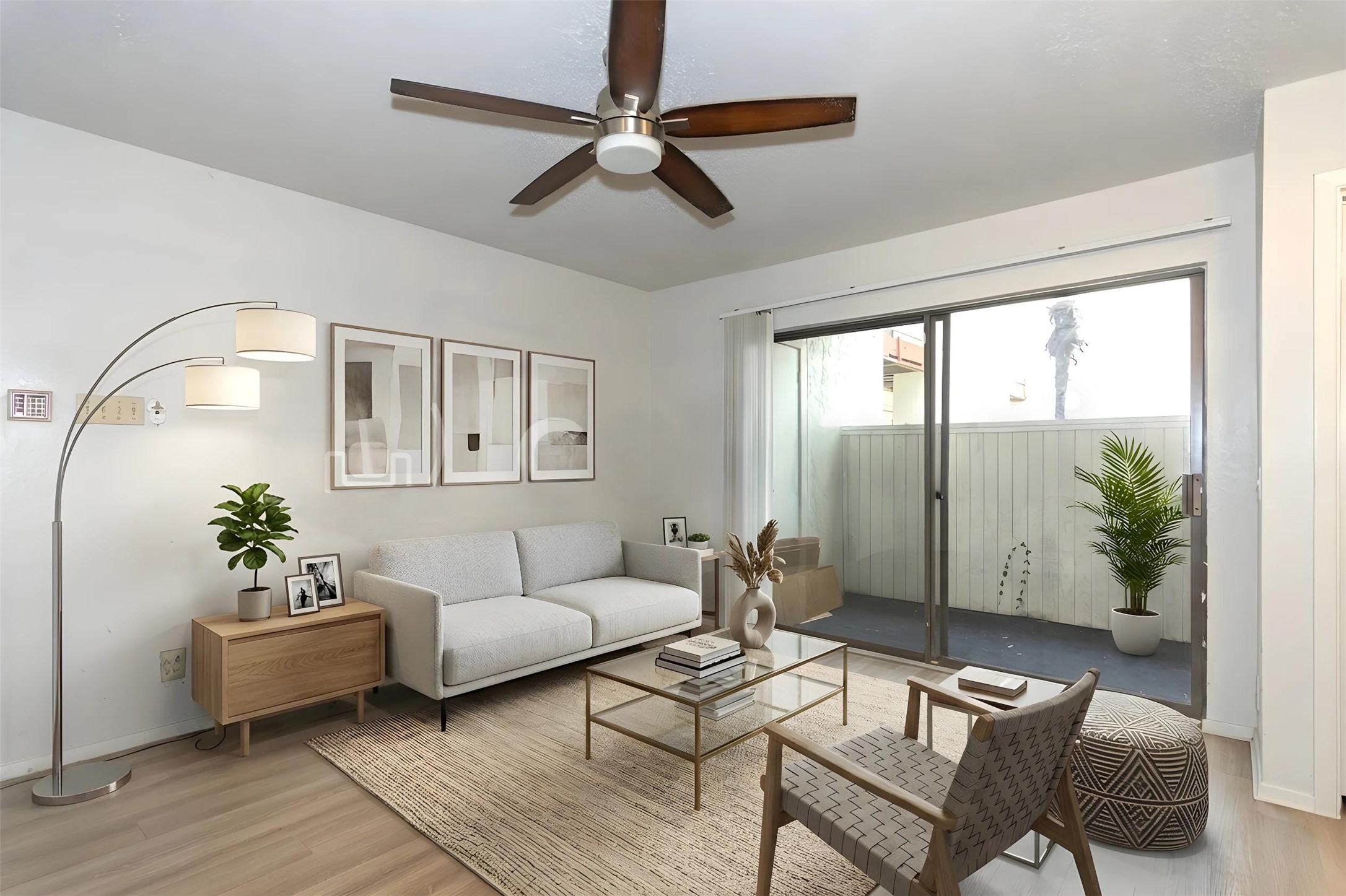 3115 Helms Street, Unit 106 Austin, TX 78705 - Photo 2 of 7 An inviting living area extends to a private balcony through sliding glass doors.
