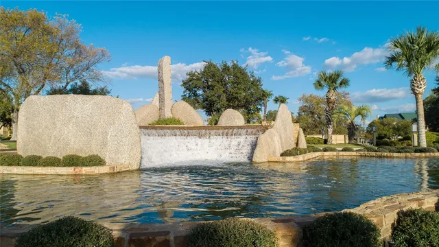 a view of swimming pool with a patio and a yard