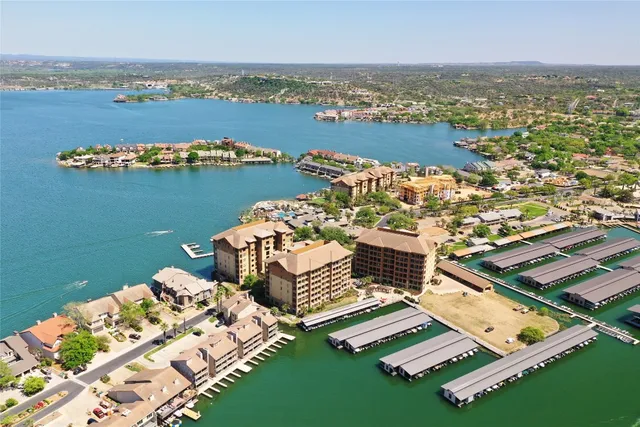 an aerial view of a house with a lake view