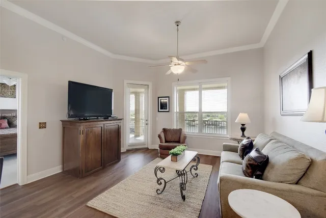 an aerial view of a residential houses with outdoor space and lake view