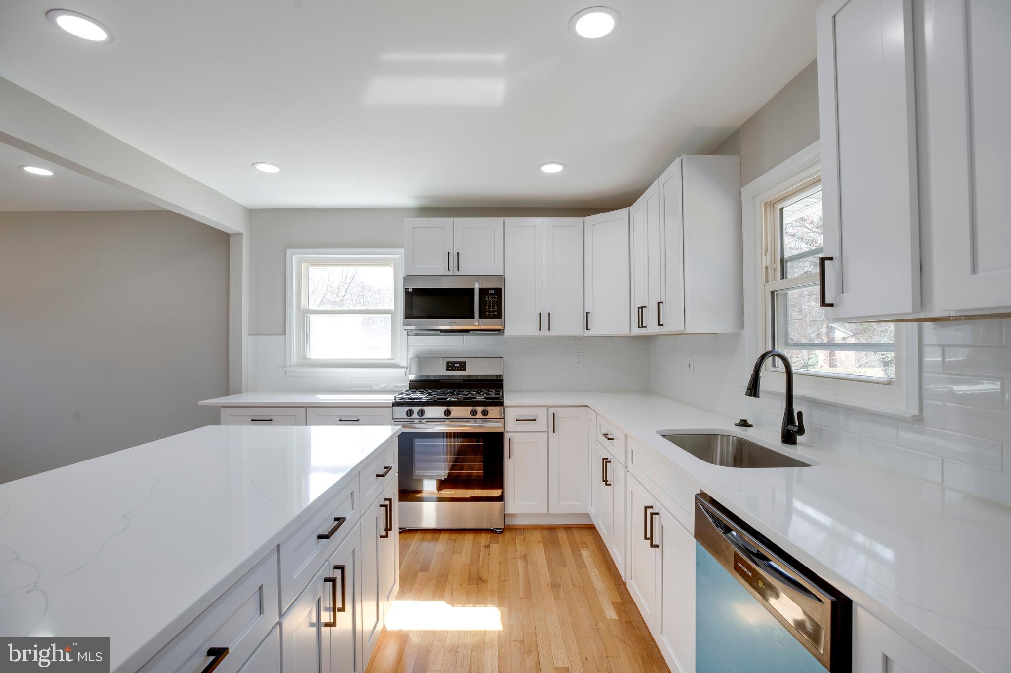 4352 Granby Road Woodbridge, VA 22193 - Photo 16 of 50 a kitchen with stainless steel appliances granite countertop a sink stove and refrigerator