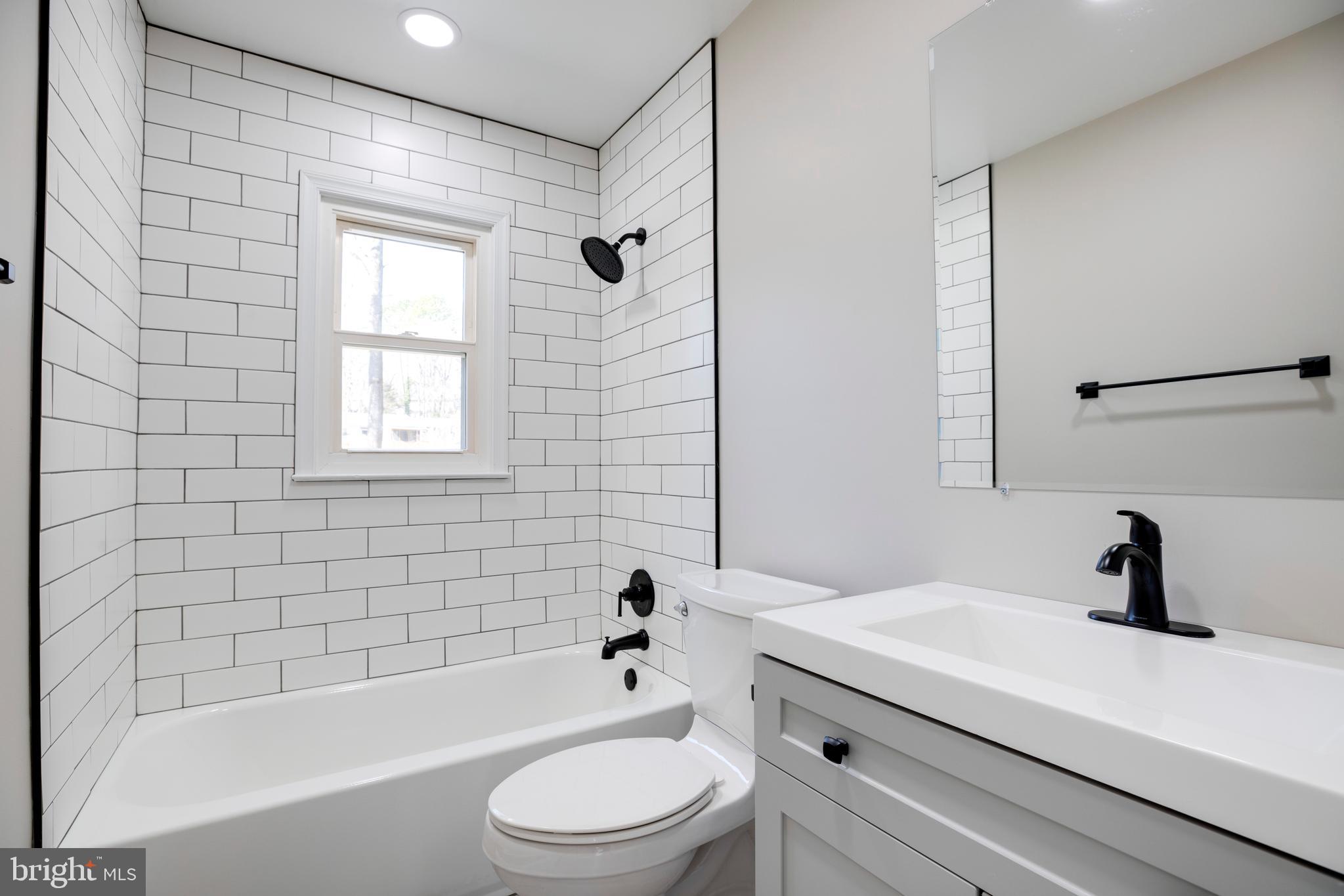4352 Granby Road Woodbridge, VA 22193 - Photo 20 of 50 a bathroom with a bathtub shower sink vanity mirror and toilet