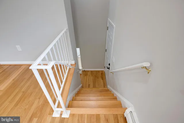 a view of staircase with white walls