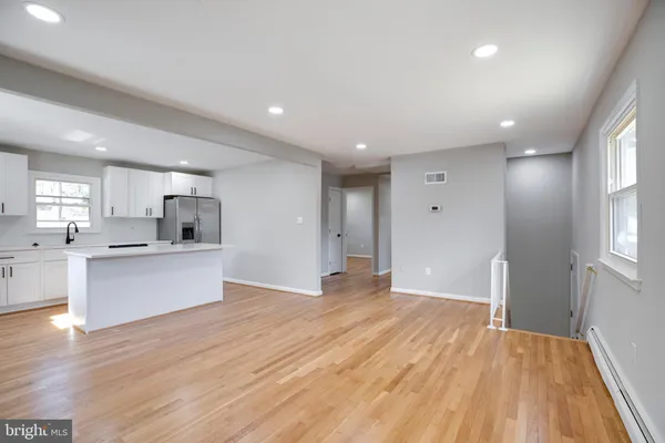a view of kitchen with wooden floor