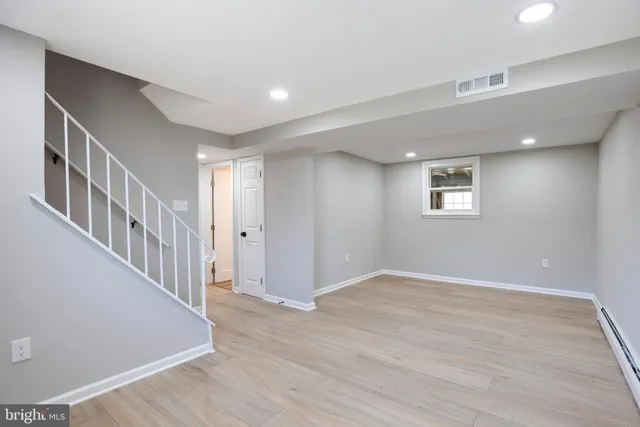 a view of an entryway with wooden floor