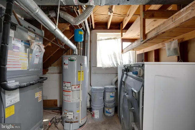 a view of a house with a big yard and large trees