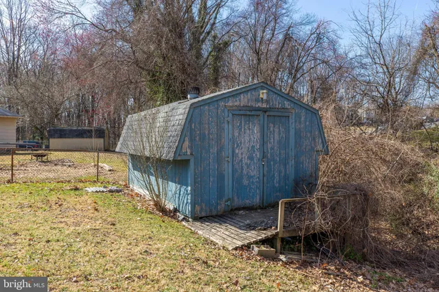 a view of outdoor space with deck and trees