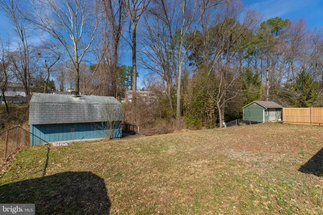 a view of a house with a yard and garage