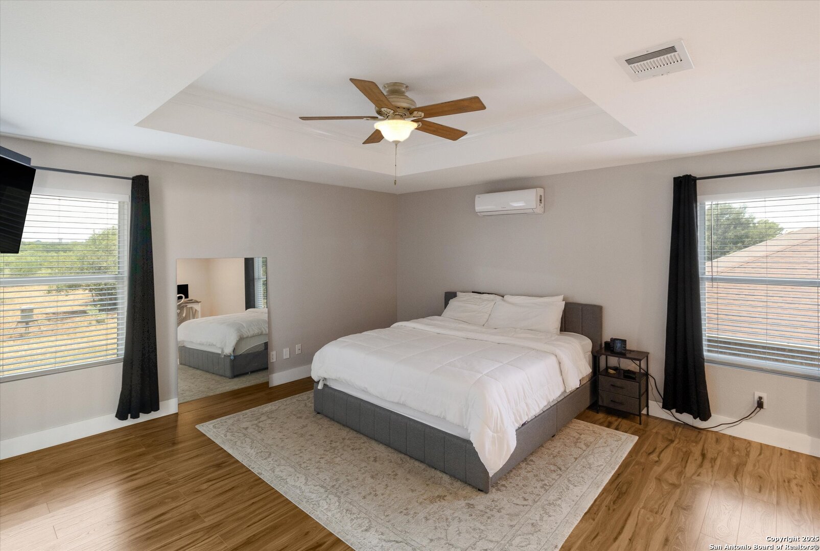 9210 Cedar Point Helotes, TX 78023 - Photo 15 of 22 a bedroom with a large bed and a window