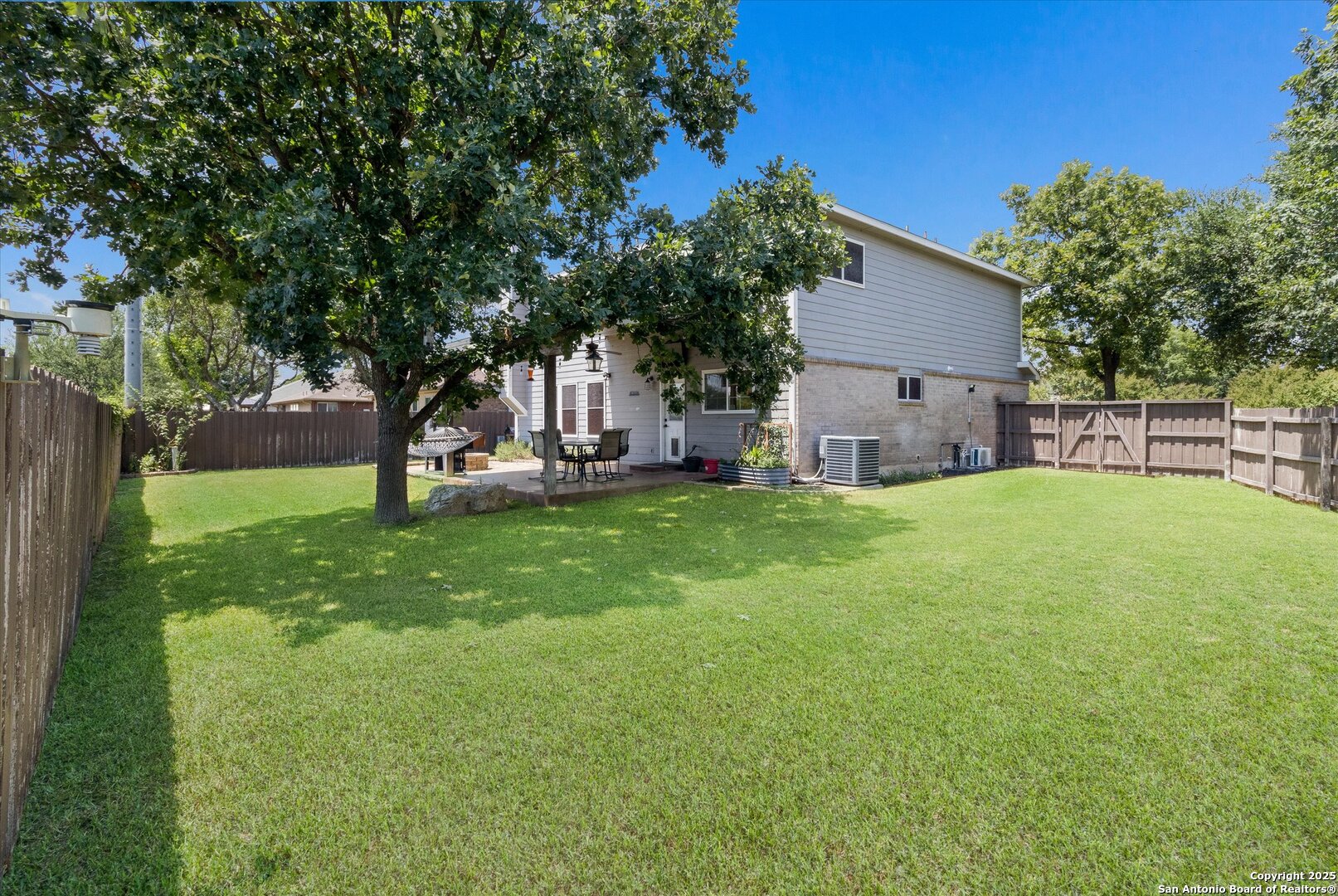 9210 Cedar Point Helotes, TX 78023 - Photo 20 of 22 a view of a house with a yard porch and sitting area