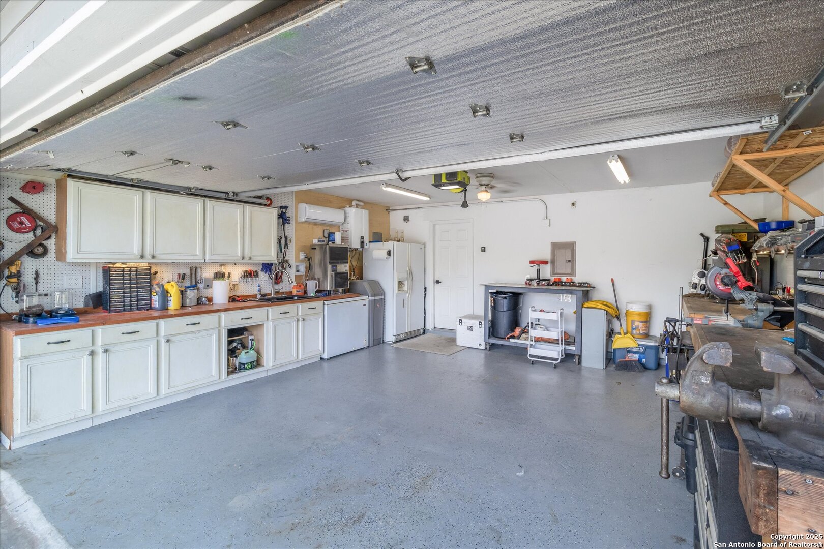 9210 Cedar Point Helotes, TX 78023 - Photo 22 of 22 a kitchen with lots of counter top space and a view of living room