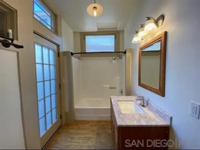 a bathroom with a sink and a mirror