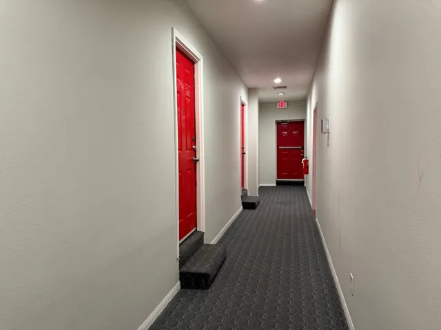 a view of hallway with wooden floor