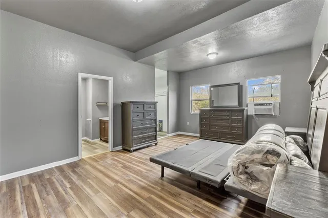 a bedroom with a bed and dresser