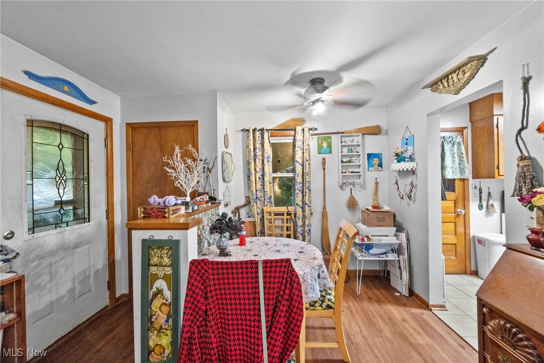 1090 Plymouth Ridge Road Ashtabula, OH 44004 - Photo 5 of 26 Dining room with light wood-type flooring and ceiling fan