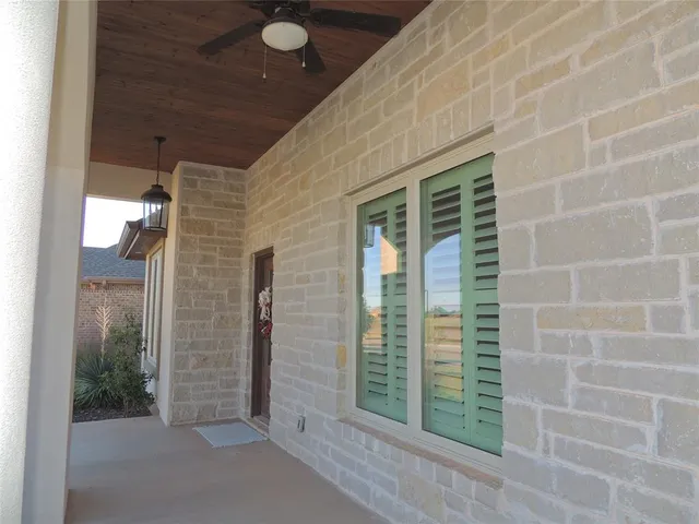 a view of outdoor space with sliding door and wooden floor