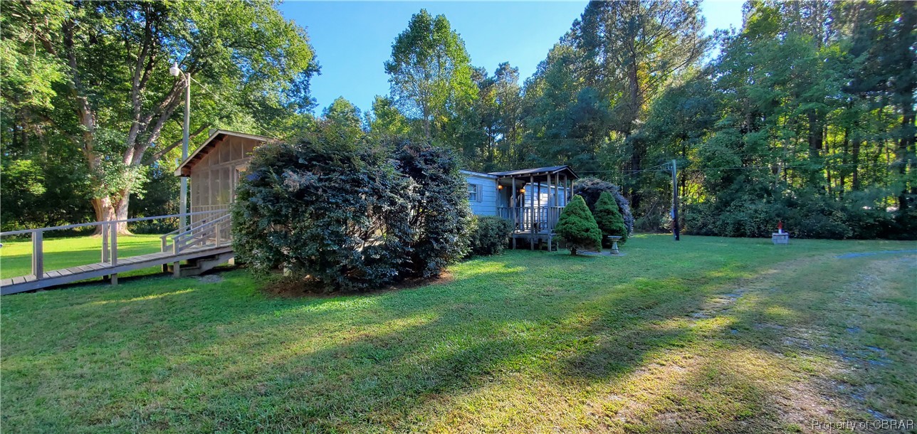 368 Osprey Road Cardinal, VA 23025 - Photo 2 of 23 a view of a house with backyard and garden