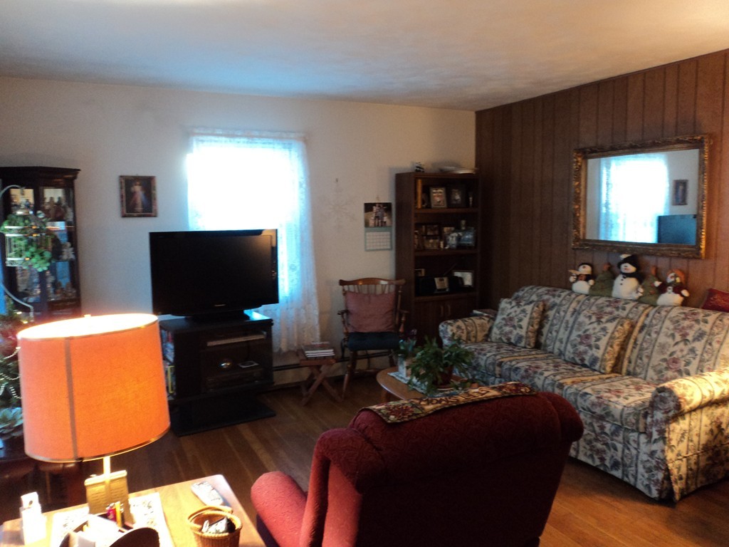 36 Longview Road New Bedford, MA 02745 - Photo 5 of 12 a living room with furniture and a flat screen tv