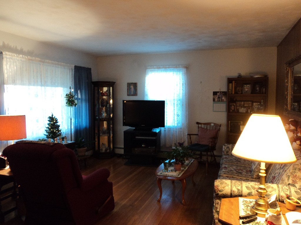 36 Longview Road New Bedford, MA 02745 - Photo 6 of 12 a living room with furniture and a flat screen tv