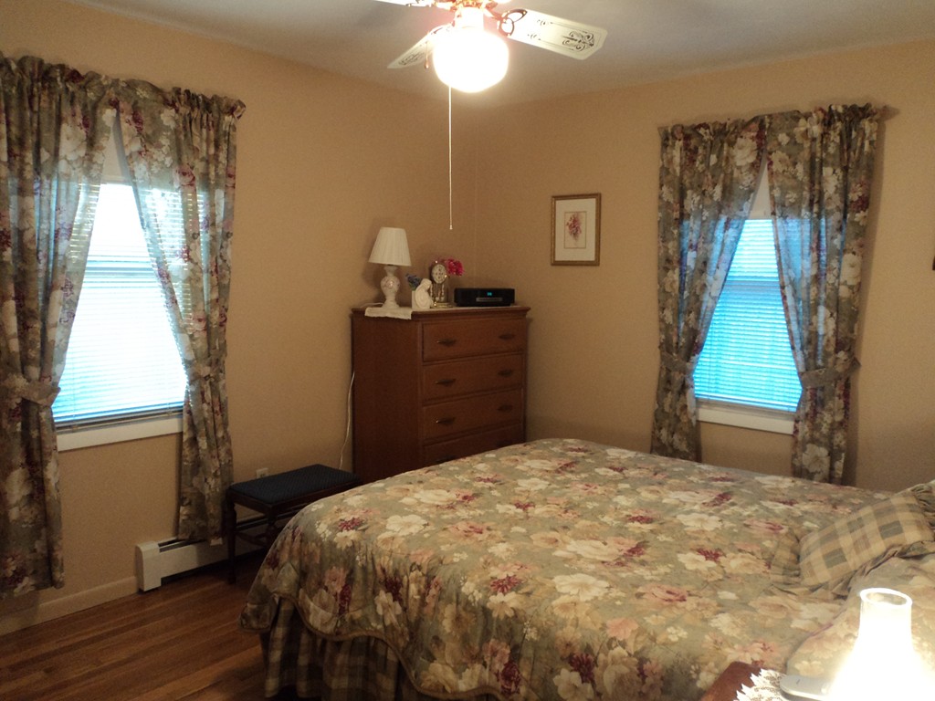 36 Longview Road New Bedford, MA 02745 - Photo 10 of 12 a bedroom with a bed and a window