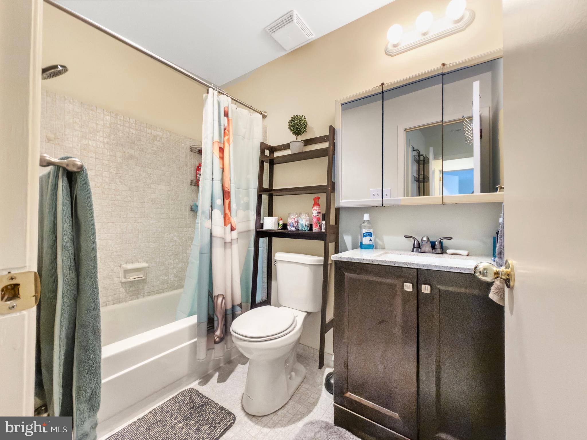 66 Old Forge Crossing, Unit 66 Devon, PA 19333 - Photo 13 of 16 a bathroom with a sink toilet and shower