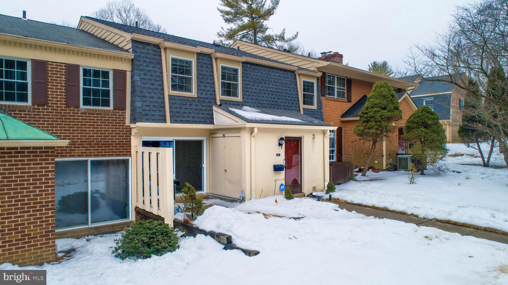 66 Old Forge Crossing, Unit 66 Devon, PA 19333 - Photo 2 of 16 a front view of a house with a yard