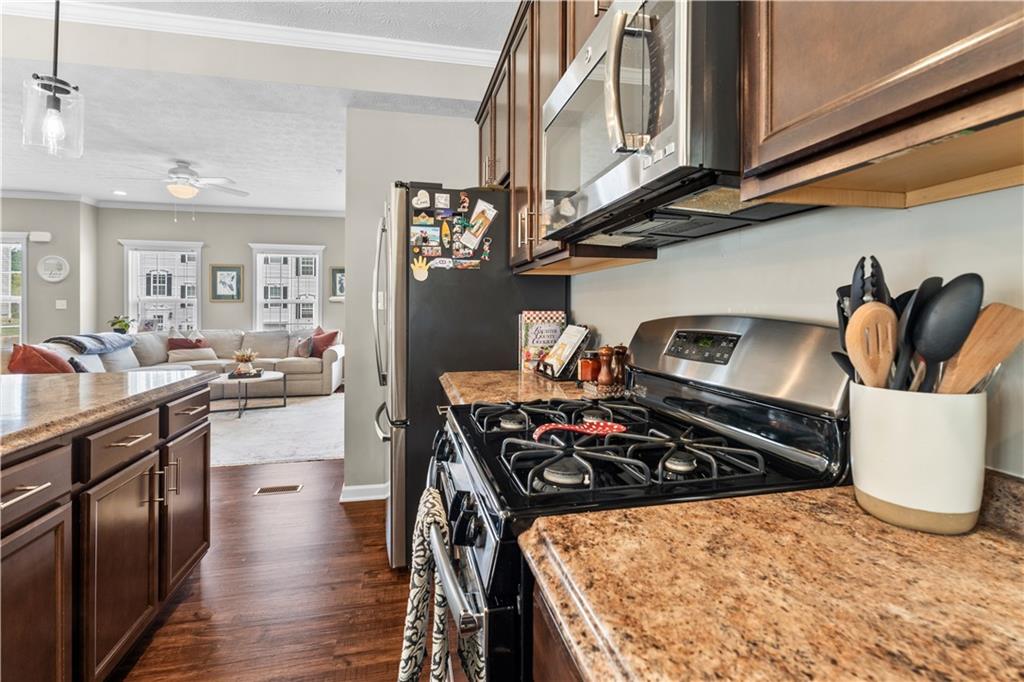 159 Rylie Drive Harmony, PA 16037 - Photo 16 of 36 a kitchen with stainless steel appliances granite countertop a stove and a sink