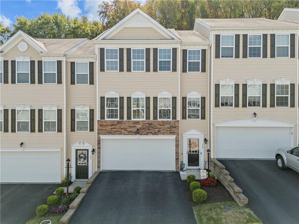 159 Rylie Drive Harmony, PA 16037 - Photo 2 of 36 a front view of a house with a garden