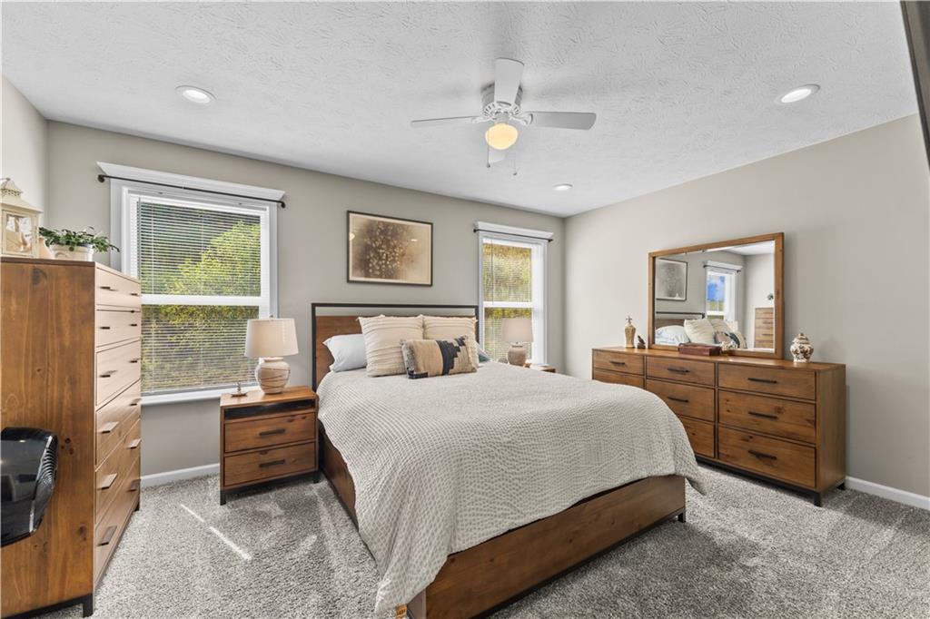 159 Rylie Drive Harmony, PA 16037 - Photo 23 of 36 a bedroom with a bed and dresser with mirror