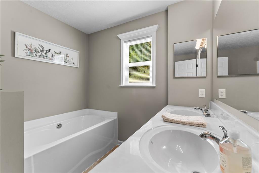 159 Rylie Drive Harmony, PA 16037 - Photo 26 of 36 a bathroom with a bathtub and a sink