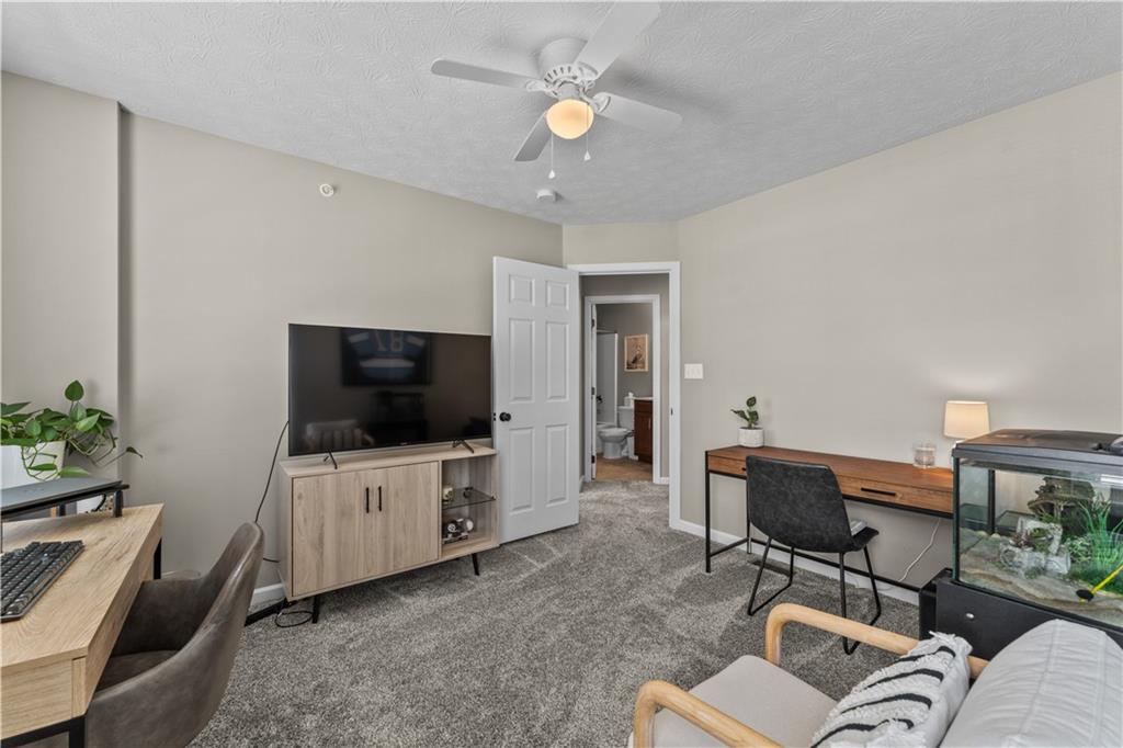 159 Rylie Drive Harmony, PA 16037 - Photo 32 of 36 a living room with furniture and a flat screen tv