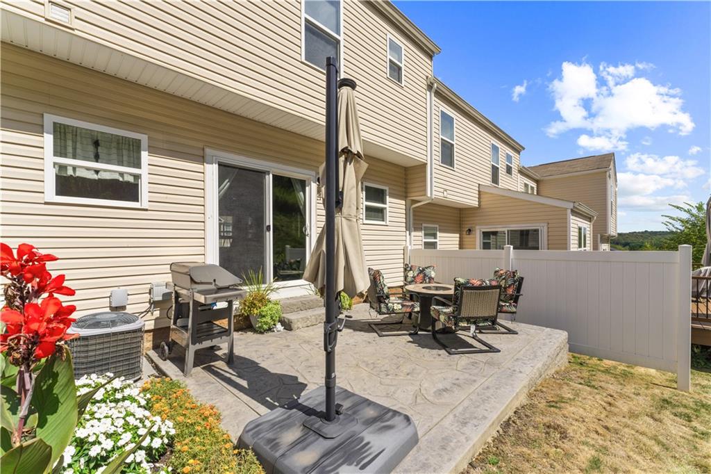 159 Rylie Drive Harmony, PA 16037 - Photo 33 of 36 a view of a patio with table and chairs and potted plants