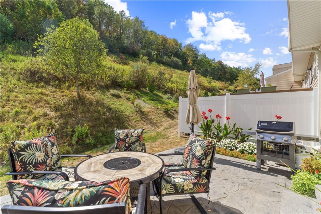 159 Rylie Drive Harmony, PA 16037 - Photo 34 of 36 a backyard of a house with table and chairs