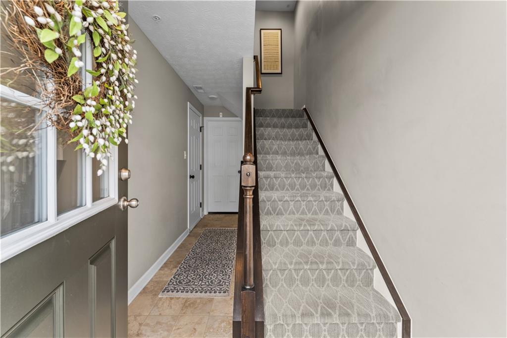 159 Rylie Drive Harmony, PA 16037 - Photo 4 of 36 a view of a hallway with wooden floor and staircase