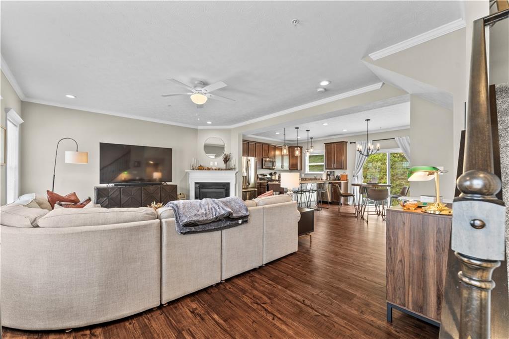 159 Rylie Drive Harmony, PA 16037 - Photo 9 of 36 a living room with furniture a fireplace and a flat screen tv