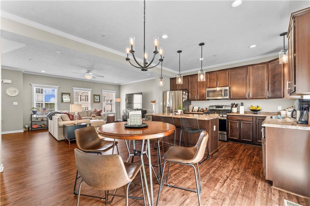 159 Rylie Drive Harmony, PA 16037 - Photo 10 of 36 a large kitchen with a table and chairs