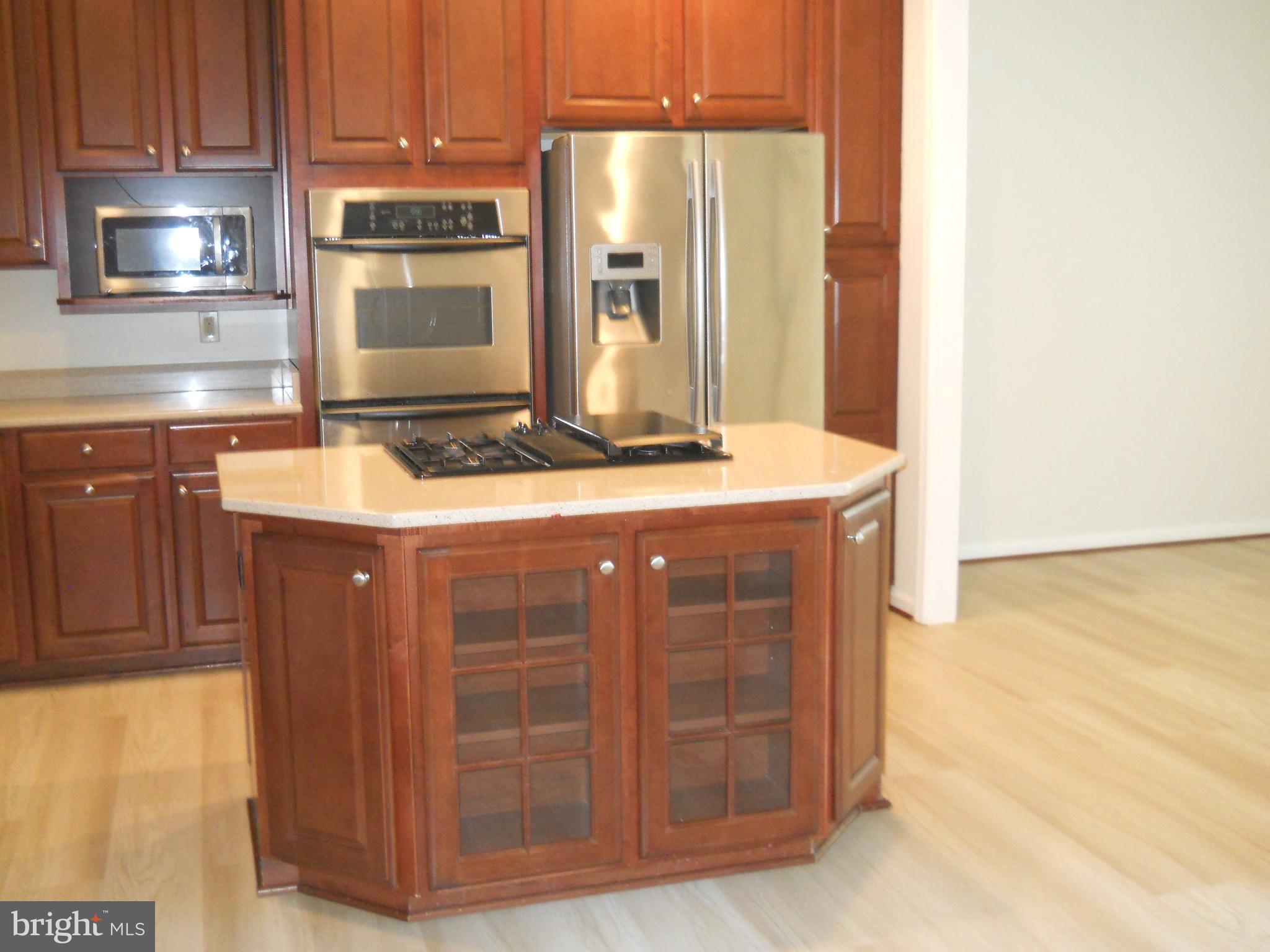 2807 Cornet Court Silver Spring, MD 20904 - Photo 11 of 44 a kitchen with stainless steel appliances granite countertop a sink and a stove