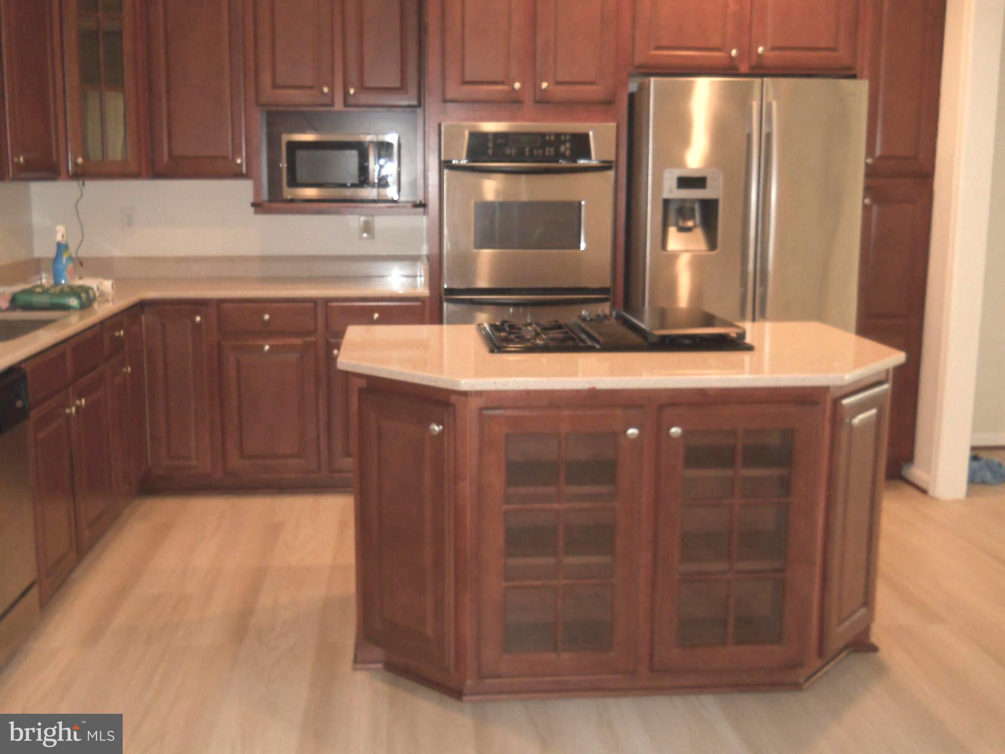 2807 Cornet Court Silver Spring, MD 20904 - Photo 12 of 44 a kitchen with stainless steel appliances granite countertop a stove and a sink