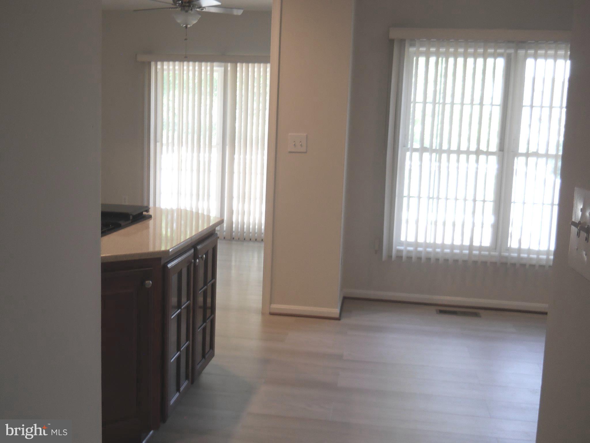 2807 Cornet Court Silver Spring, MD 20904 - Photo 16 of 44 an empty room with wooden floor and windows